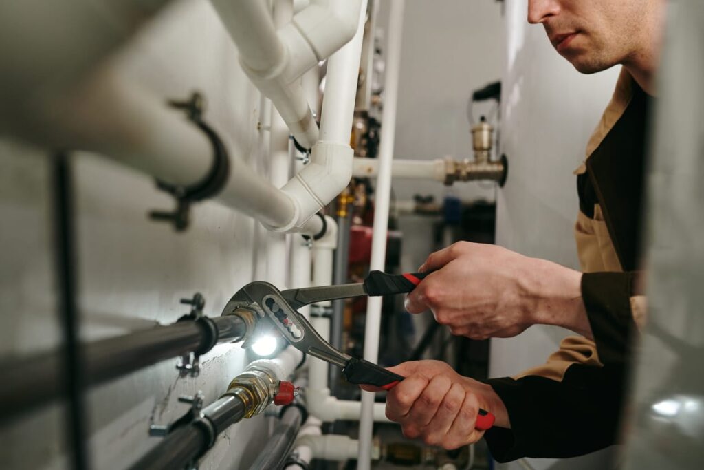 Plumbers maintaining commercial plumbing pipes in San Jacinto