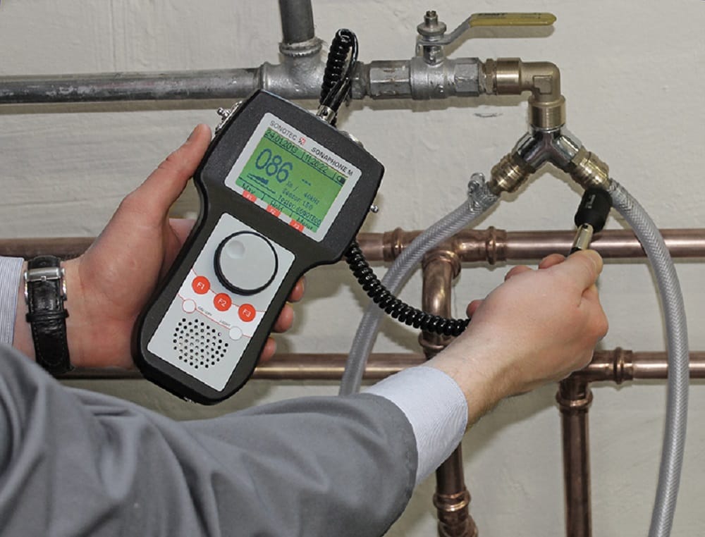 Plumber testing pipes with electronic leak detection equipment in San Jacinto